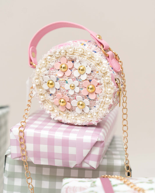 BOLSO REDONDO DE FIBRAS CON FLORES